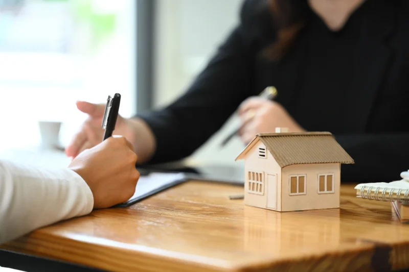 Real estate agent touring homes in Sherman Oaks with a client