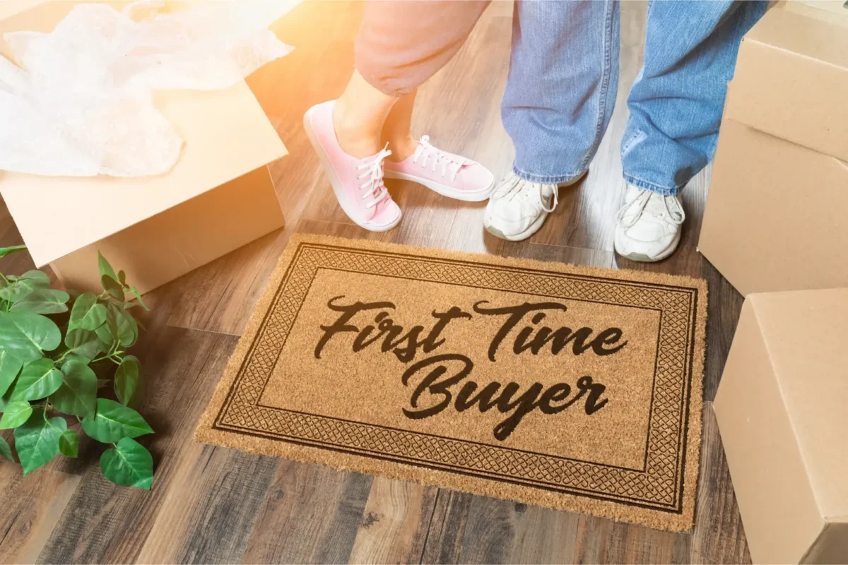 'First Time Buyer' doormat at the entrance of a new home