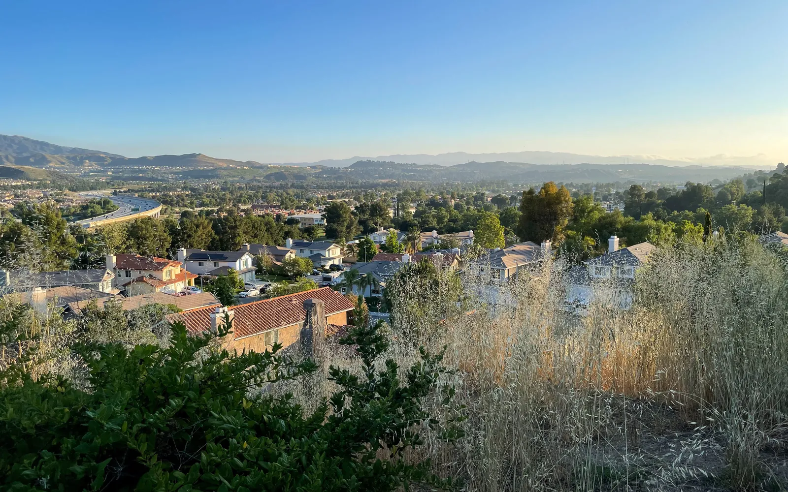 View southwest across Canyon Country, Santa Clarita, with homes and trees spread across the valley and mountains on the horizon