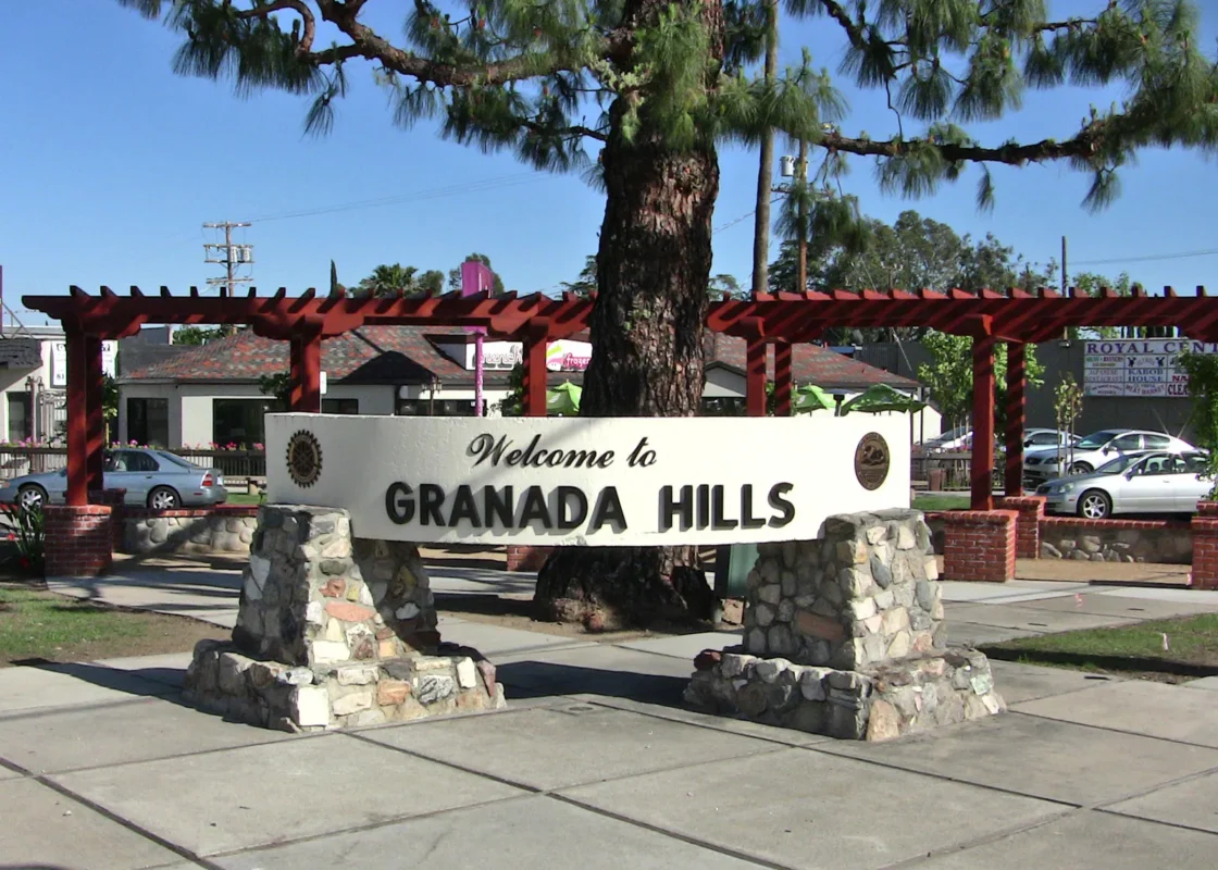 "Welcome to Granada Hills" monument sign at Veterans Triangle in Granada Hills, Los Angeles.
