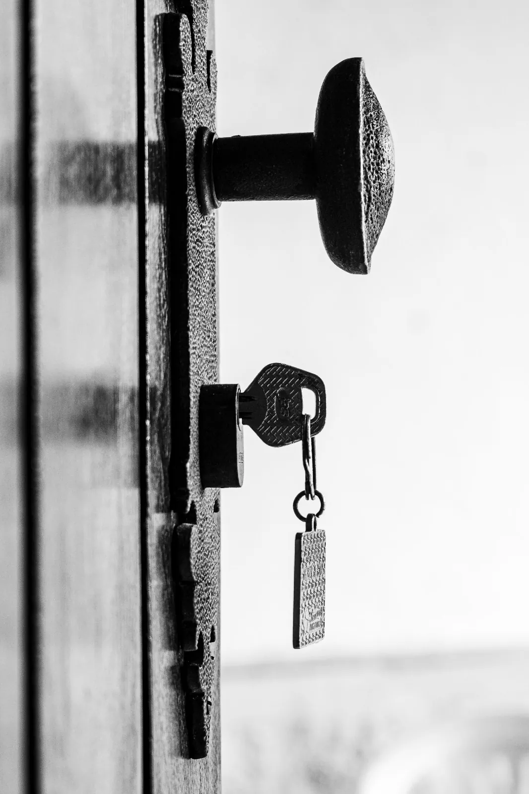 Key with a tag in the lock of a front door