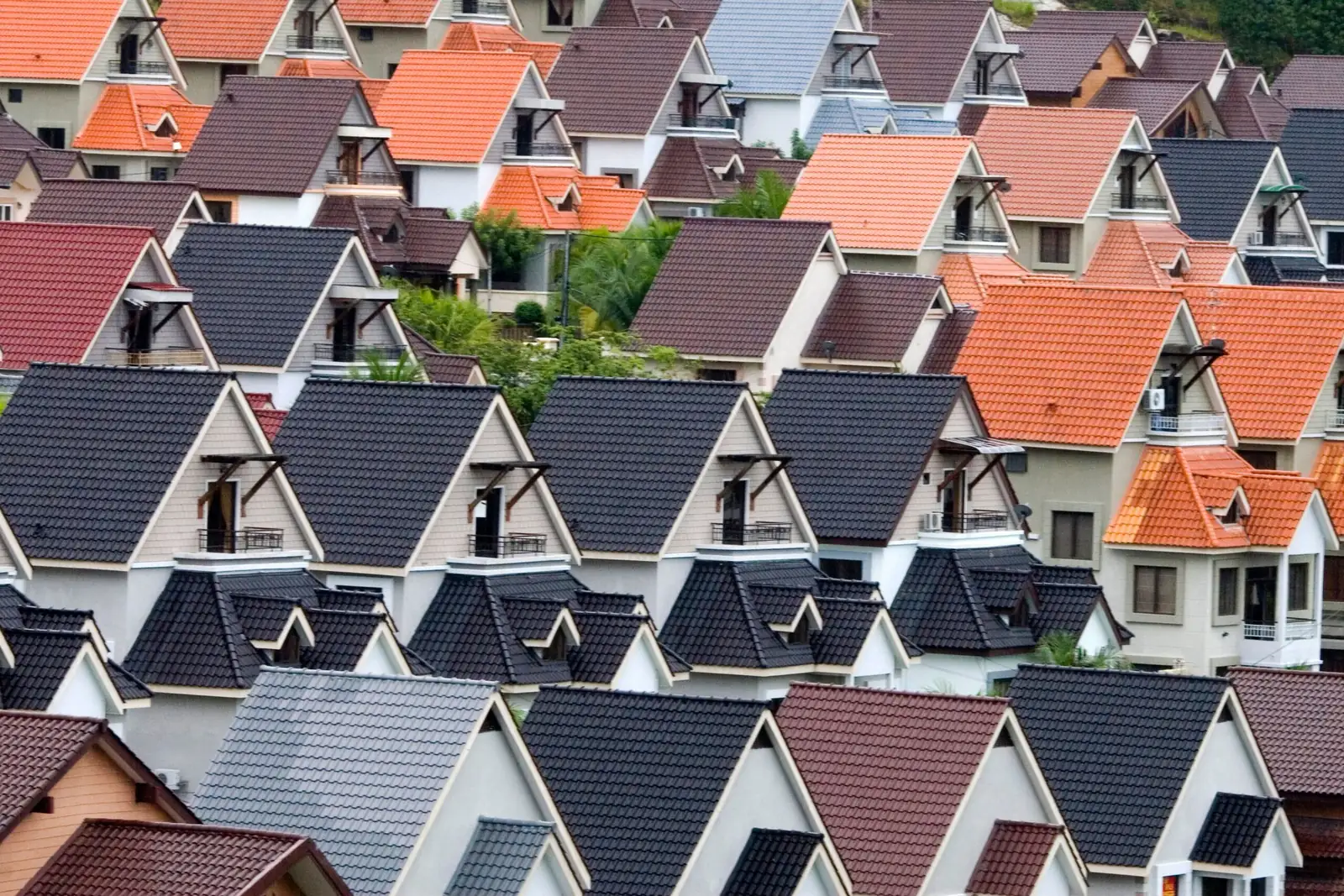 Rooftops of closely spaced suburban houses