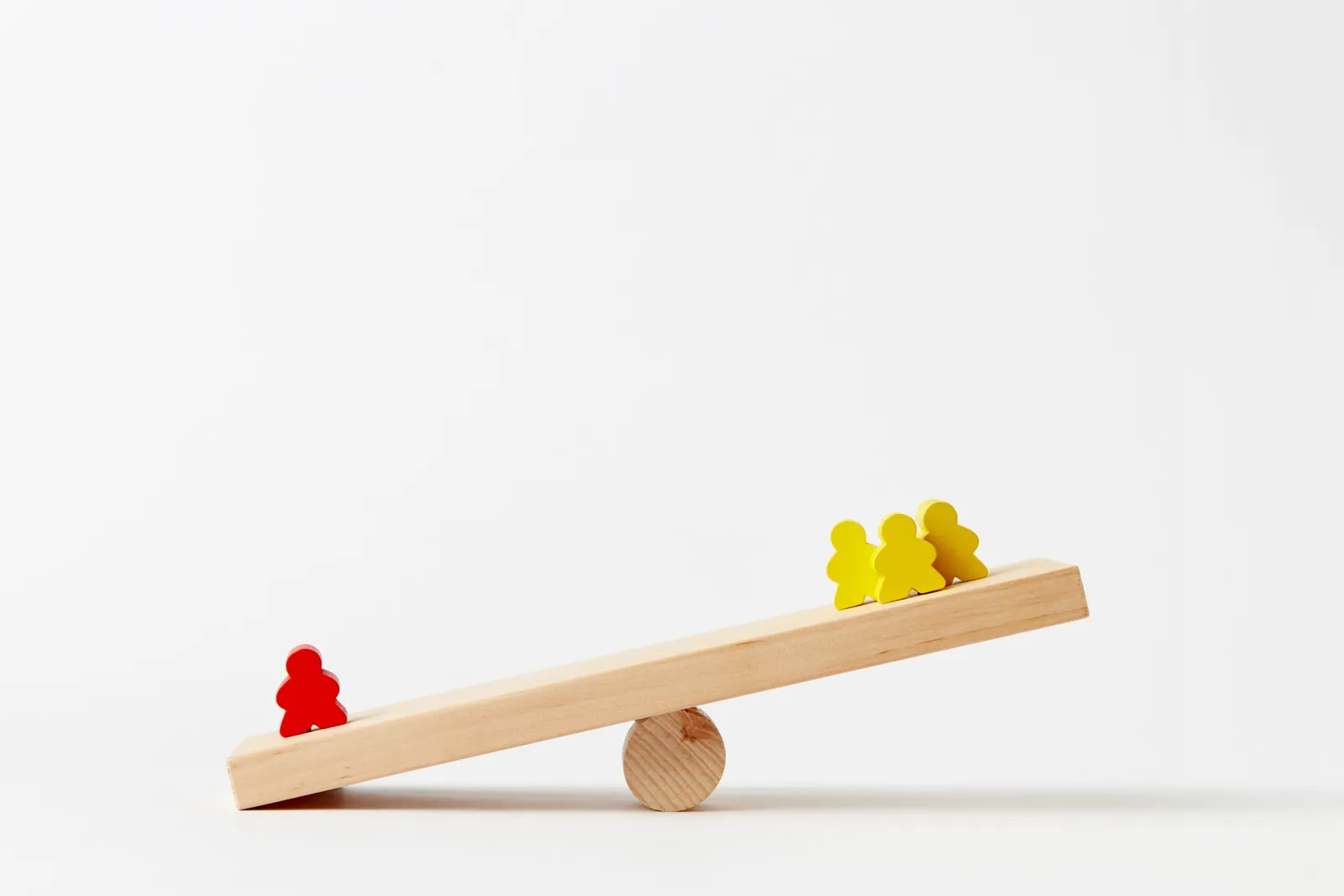 Seesaw balancing figures, illustrating a shifting market