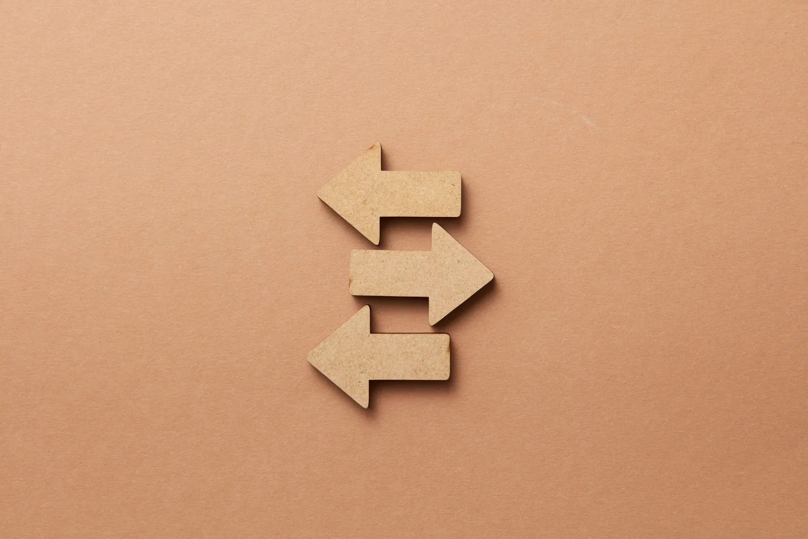 Two wooden arrows pointing in opposite directions