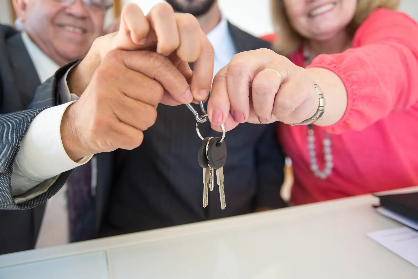 Couple holding up the keys to their new home