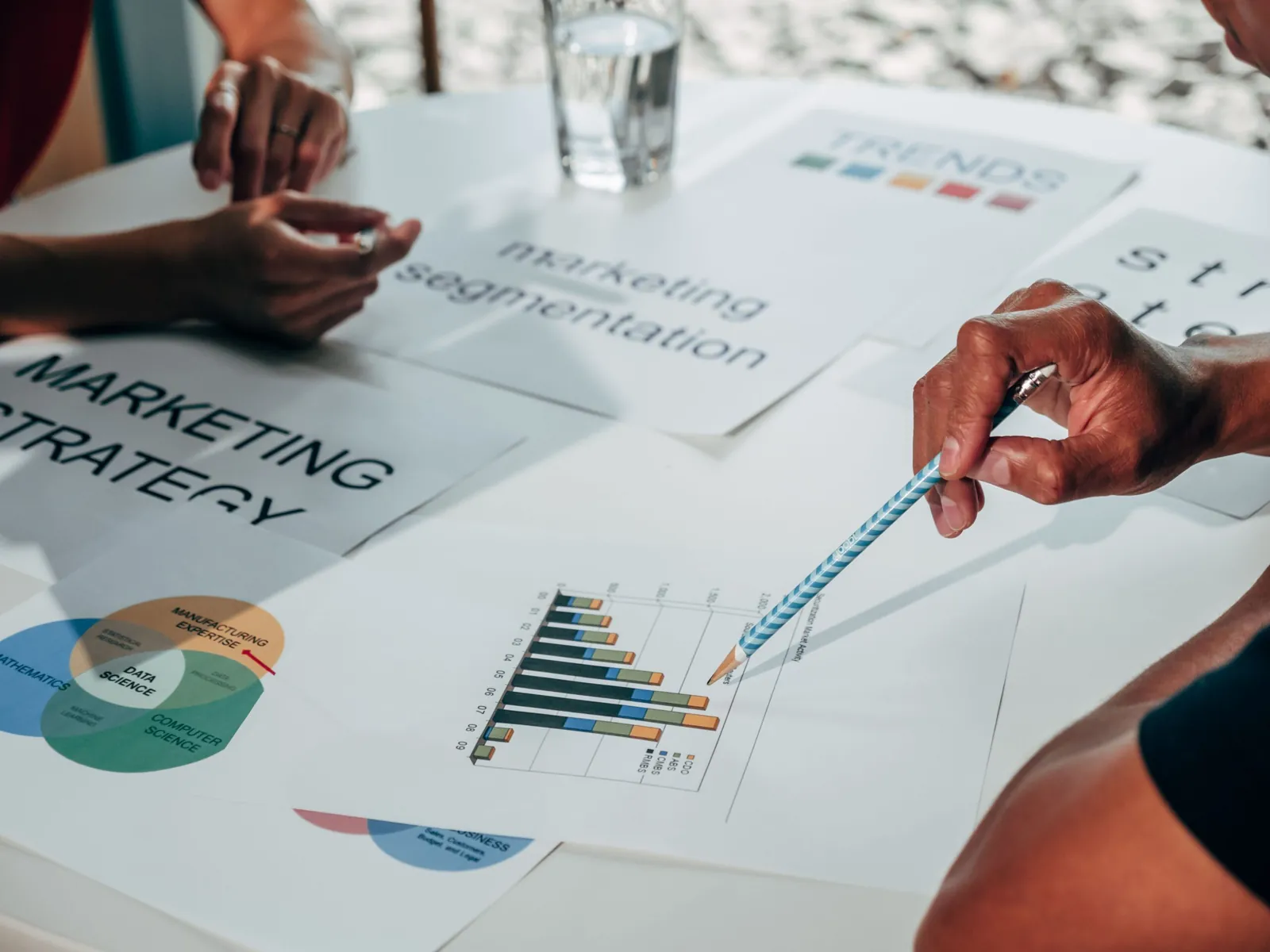 Team reviewing a marketing strategy with printed charts