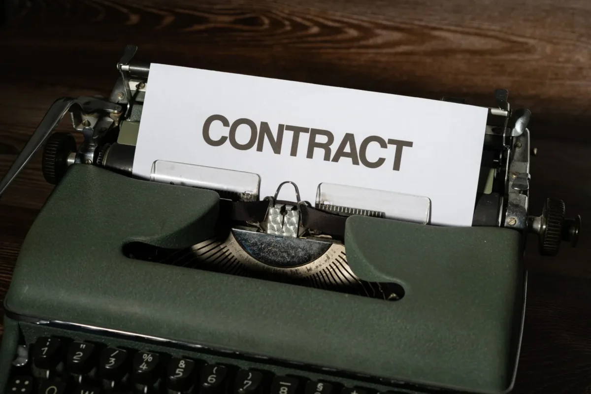 Typewriter with a sheet of paper reading Contract