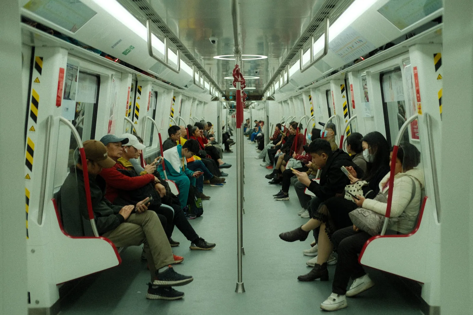 Passengers riding inside a subway car
