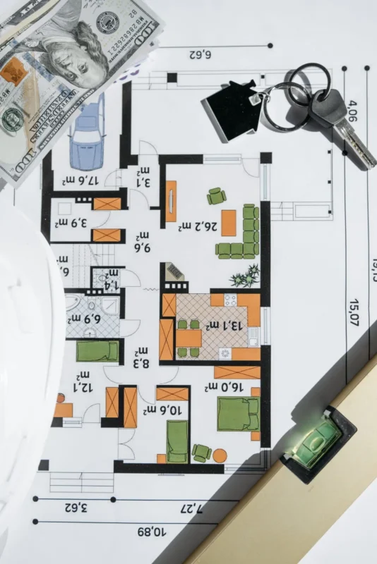 House keys on a colored floor plan