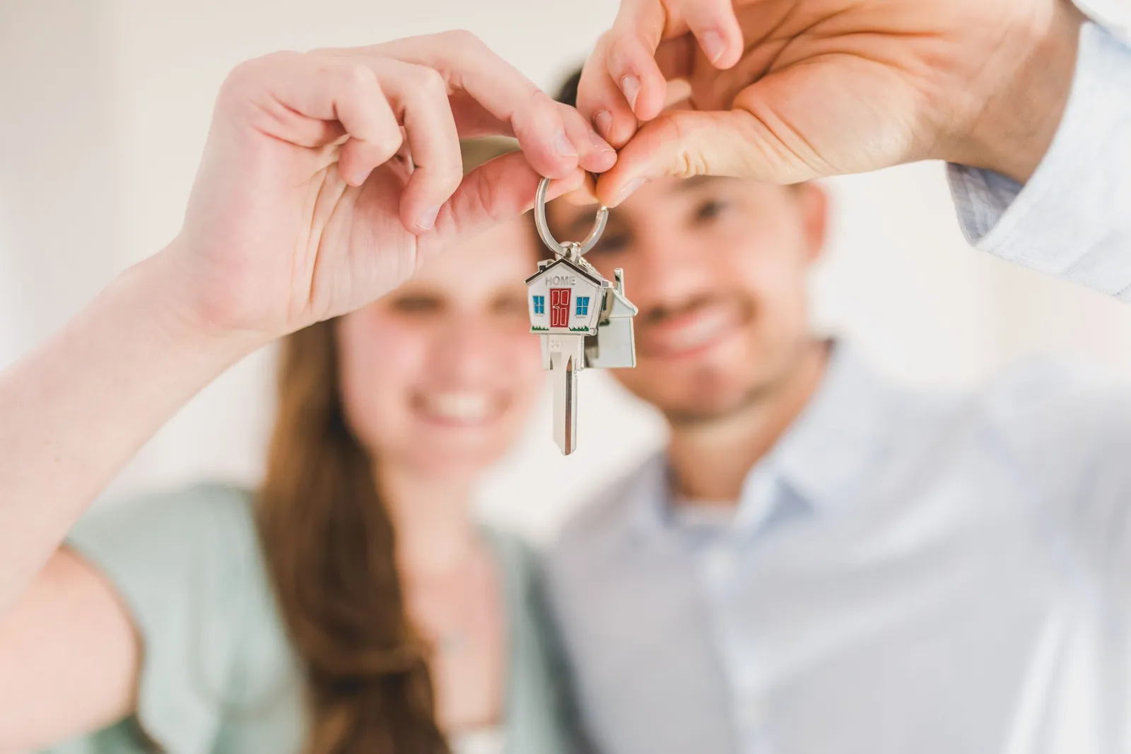 Smiling couple holding new house keys