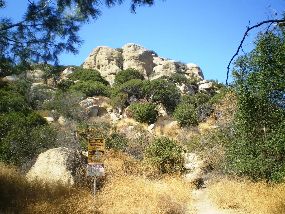 Sandstone boulders of Stoney Point rising above dry grass and brush in Chatsworth