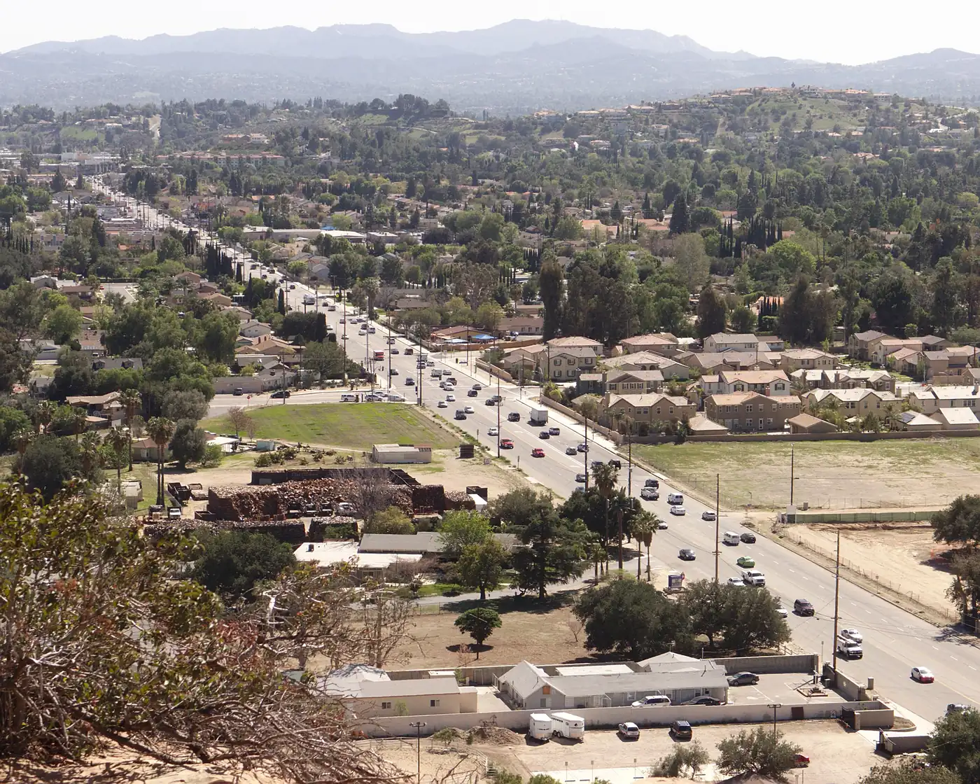 View from Stoney Point down Topanga Canyon Boulevard in Chatsworth, with homes and trees spreading toward the mountains