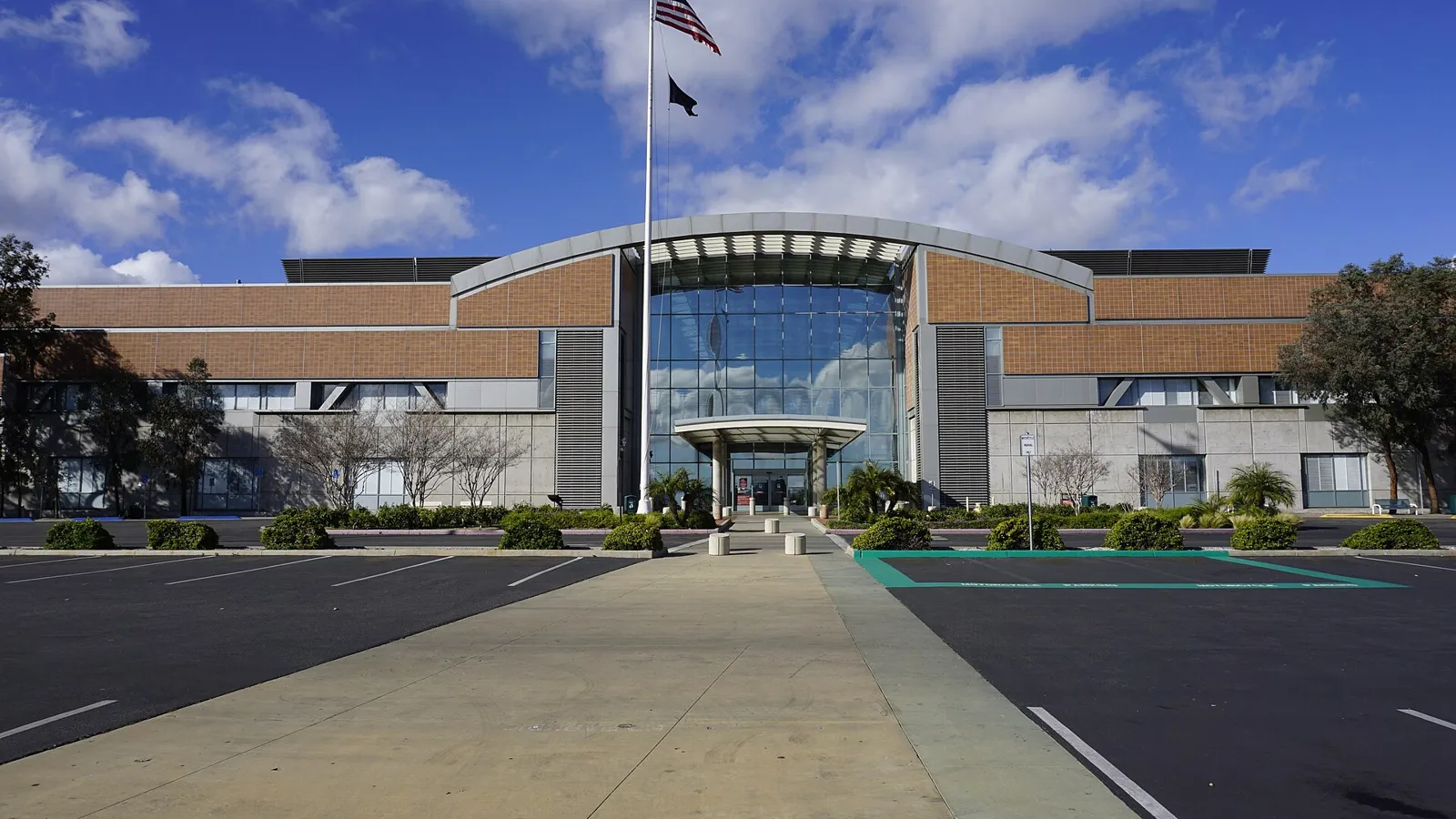 Main entrance of Building 200 at the VA Sepulveda Ambulatory Care Center in North Hills, with American flag